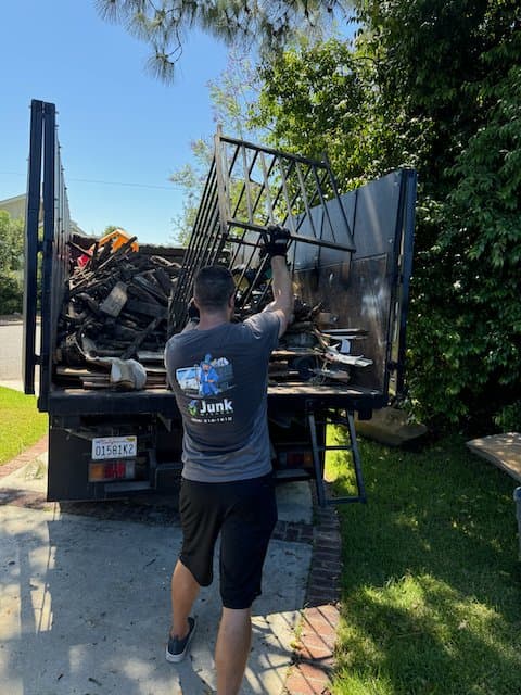 Crew member loading debris